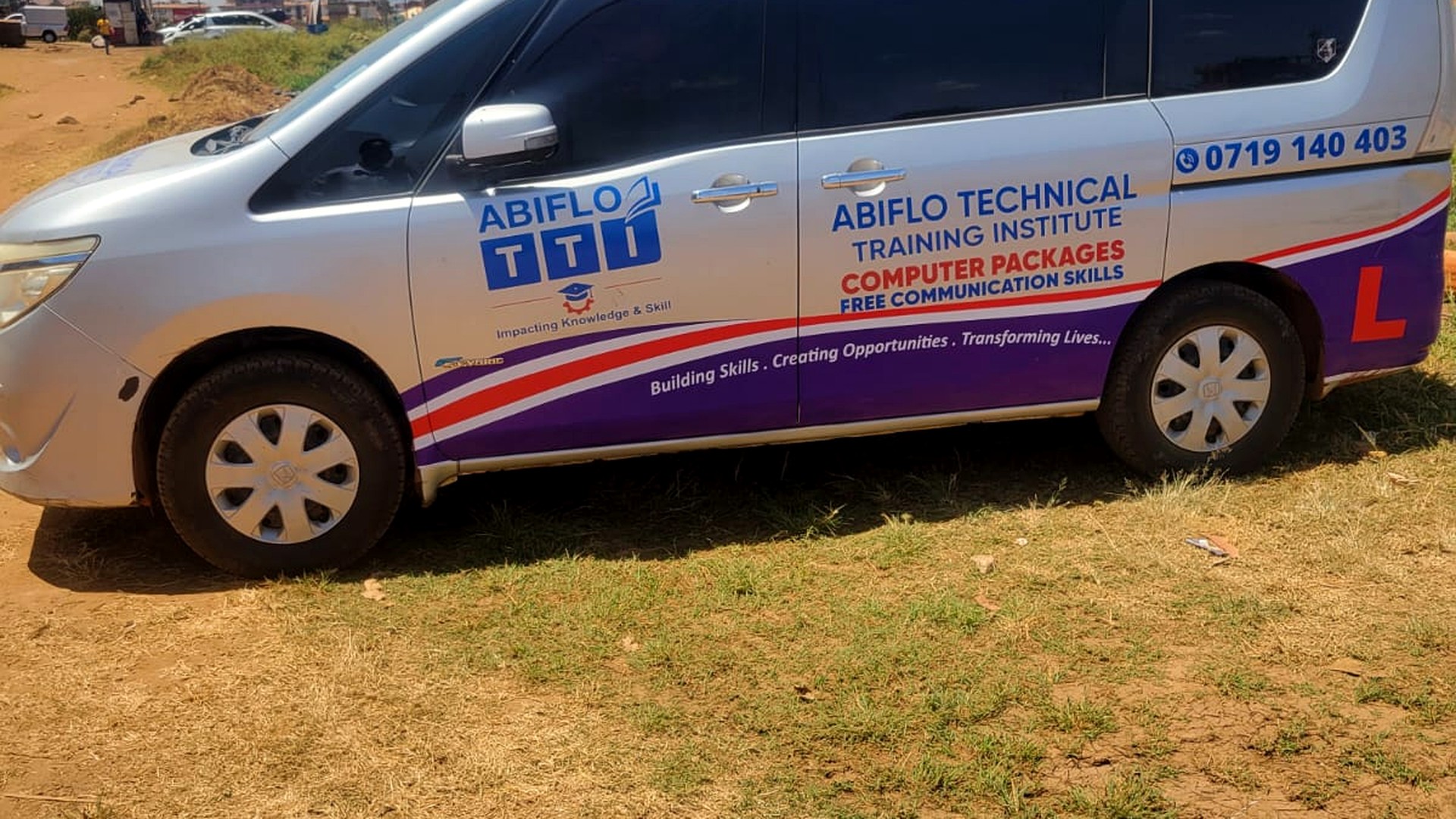 ABIFLO Technical Training Institute branded driving school vehicle